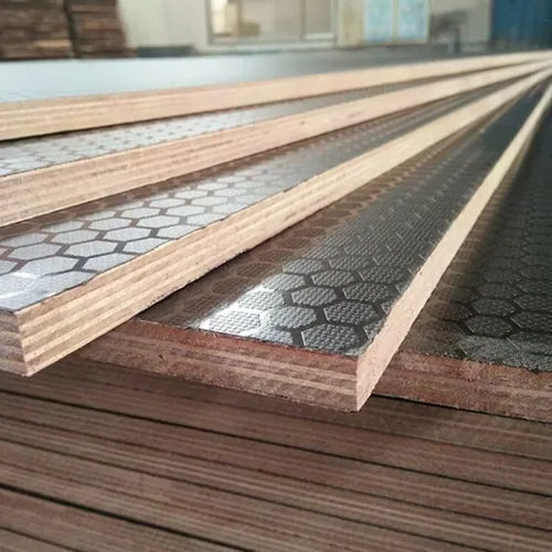 Black textured panel surfaces beside narrow plywood strips with exposed layered edges.