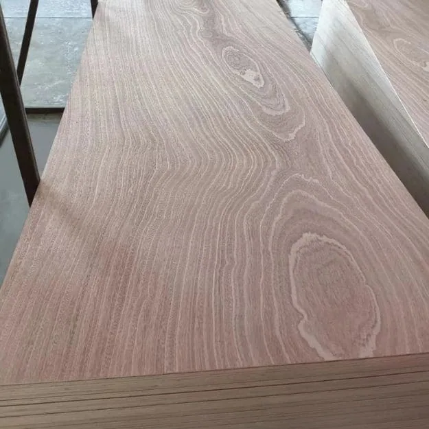 A stack of brown woodgrain-faced plywood panels with layered edges along the front.