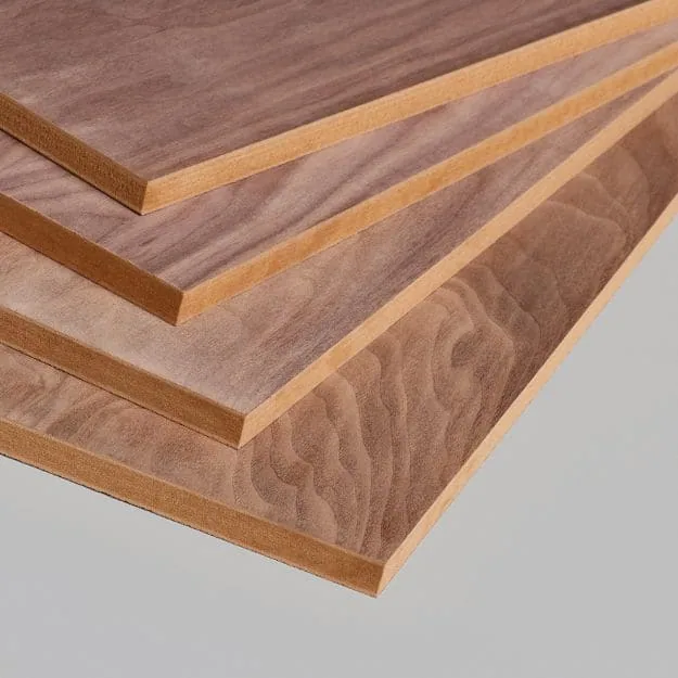Four overlapping woodgrain-faced fibreboard sheets with uniform brown core edges.